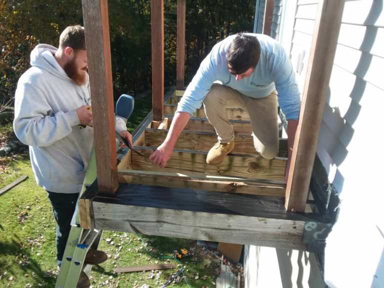 2 men building a porch